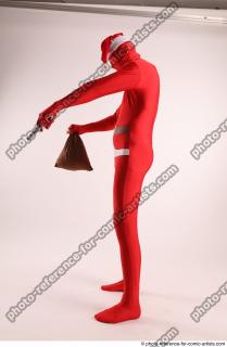 JOEL_ADAMSON CHRISTMAS VALLAIN WITH GUN AND BAG